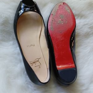 Christian Louboutin flats.